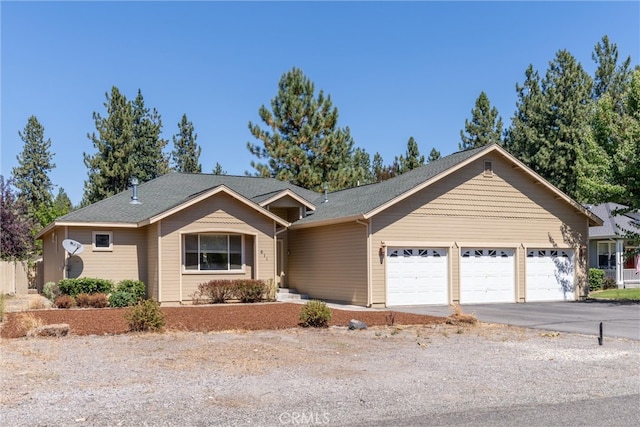 ranch-style house featuring a garage