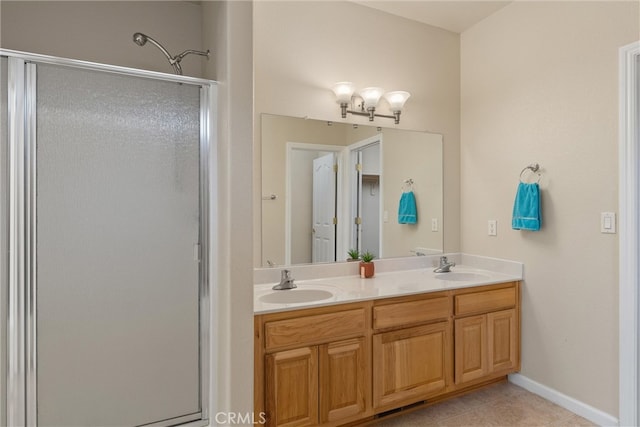 bathroom with vanity, tile patterned floors, and a shower with shower door