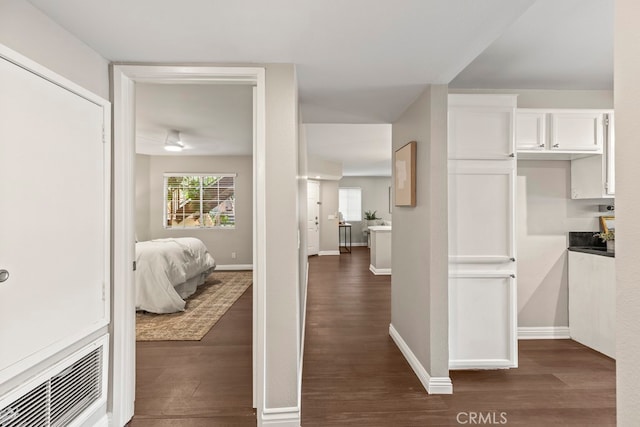 interior space with radiator and dark hardwood / wood-style floors