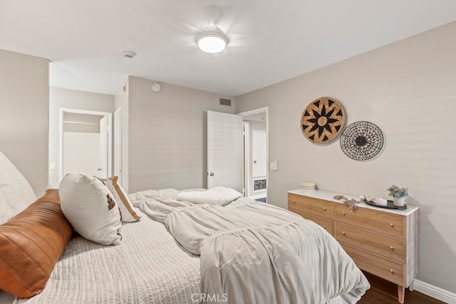 bedroom with dark wood-type flooring