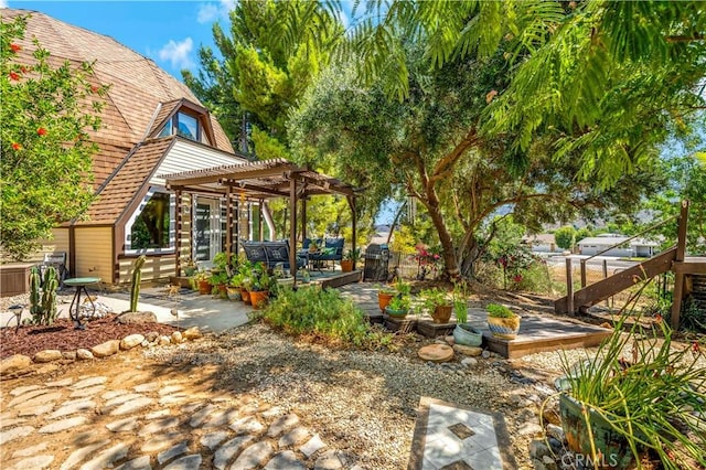 view of yard with a pergola and a patio