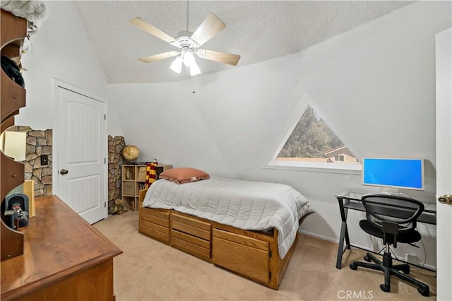 carpeted bedroom featuring a textured ceiling, vaulted ceiling, and ceiling fan