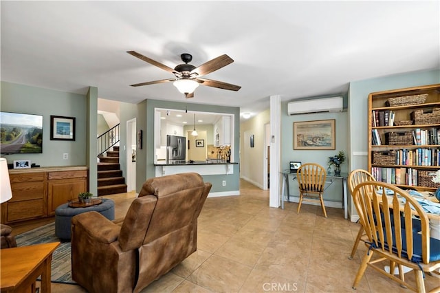 tiled living room with a wall unit AC and ceiling fan