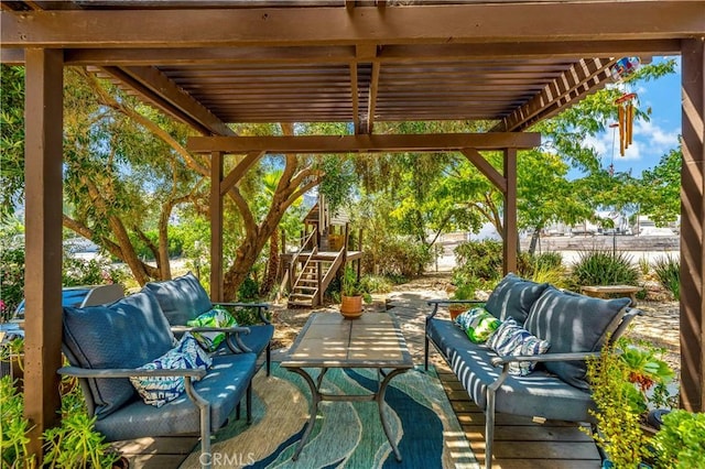 view of patio / terrace featuring an outdoor living space and a pergola