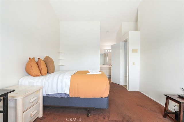 carpeted bedroom with ensuite bathroom