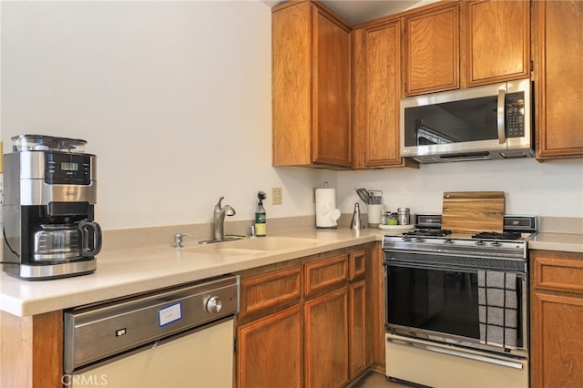 kitchen featuring stainless steel appliances and sink