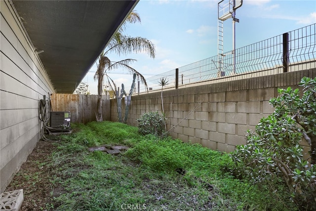 view of yard featuring central air condition unit