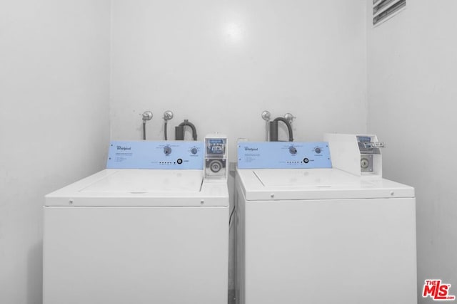 laundry room featuring separate washer and dryer