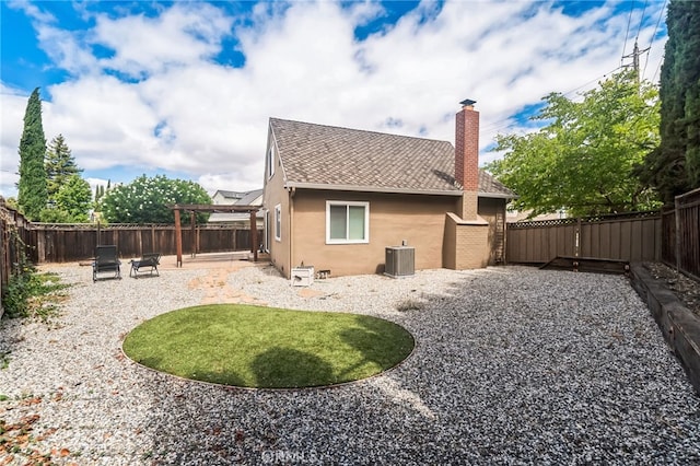 back of property featuring cooling unit and a patio area