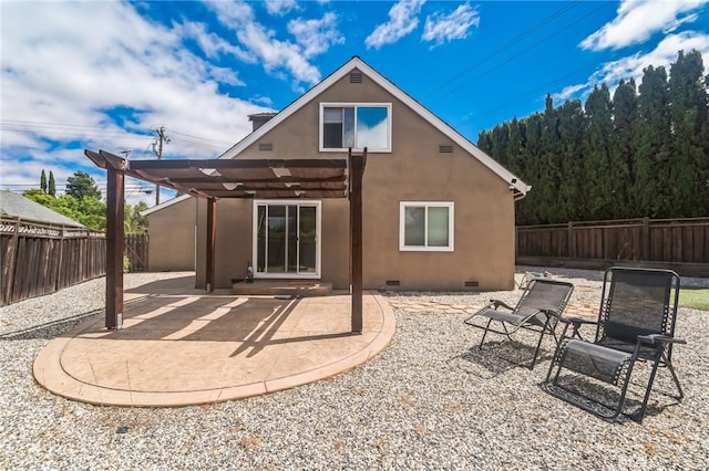 back of house with a pergola and a patio