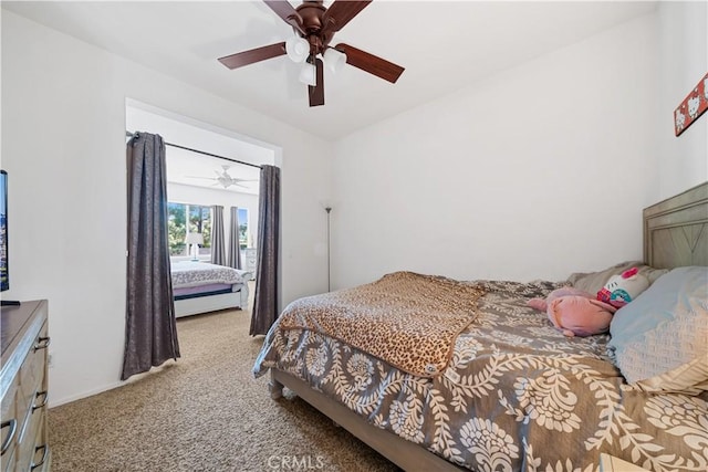 carpeted bedroom featuring a ceiling fan