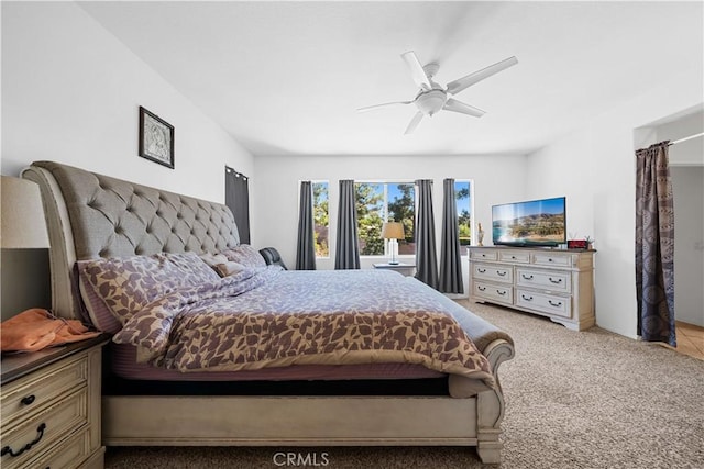 bedroom with light colored carpet and ceiling fan