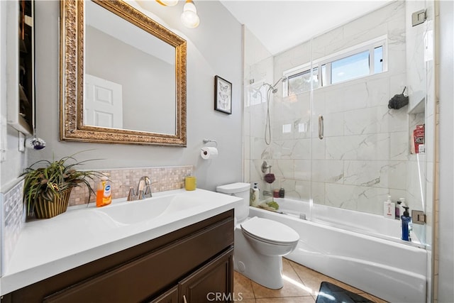 full bath featuring enclosed tub / shower combo, tile patterned flooring, toilet, vanity, and backsplash