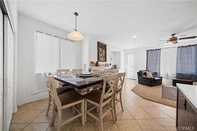 dining space featuring light tile patterned floors, a ceiling fan, and recessed lighting