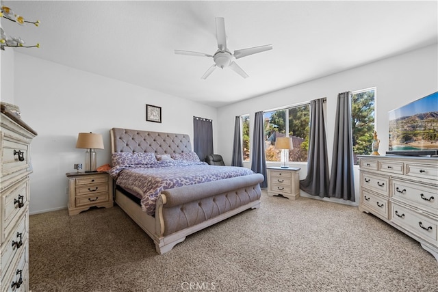 bedroom with light carpet and ceiling fan