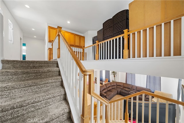 staircase with recessed lighting