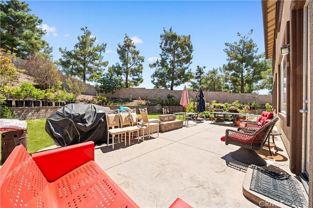 11819 La Costa Ct, Yucaipa, CA 92399 - fenced backyard with a grill, an outdoor fire pit, and a patio area