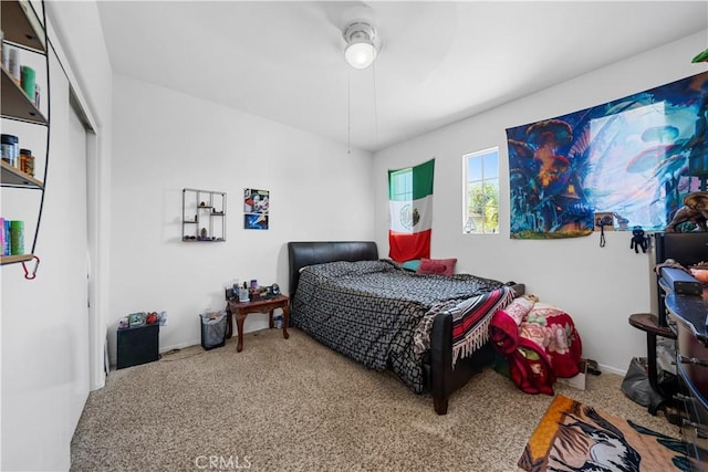 bedroom featuring a closet and carpet flooring