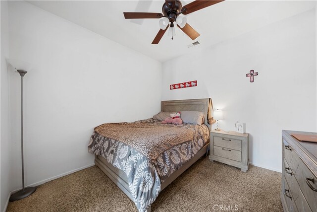 bedroom with carpet, visible vents, ceiling fan, and baseboards