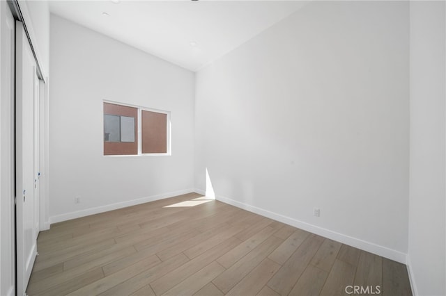 empty room with light hardwood / wood-style floors