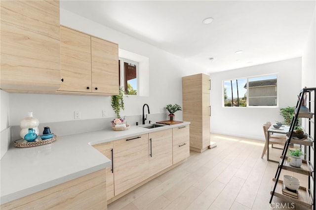 kitchen with sink and light brown cabinets