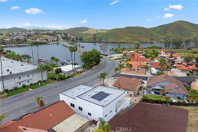 birds eye view of property with a water and mountain view