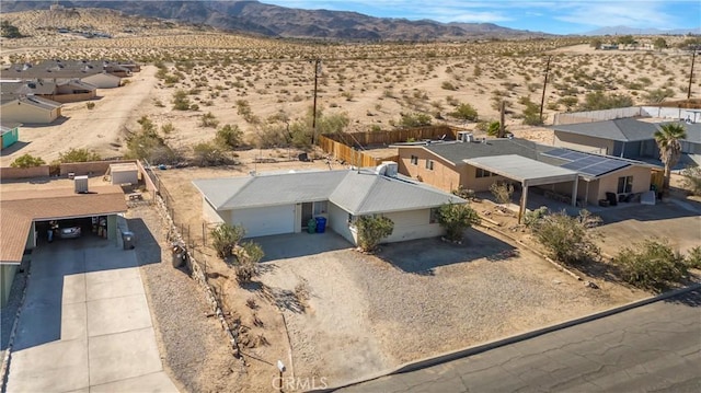 birds eye view of property with a mountain view