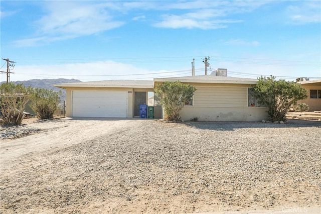 ranch-style home featuring a garage