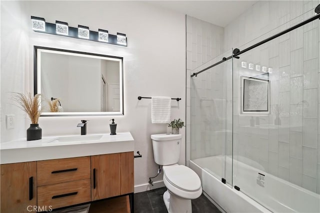 full bathroom with tile patterned flooring, vanity, enclosed tub / shower combo, and toilet