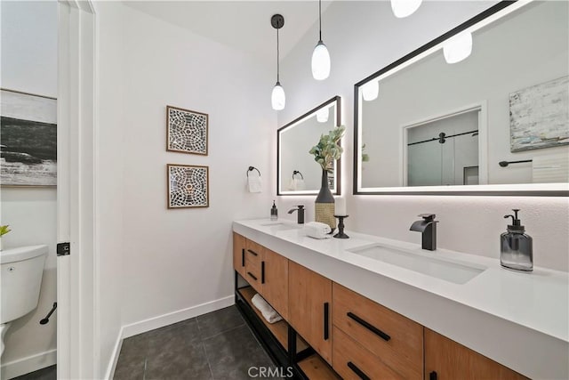 bathroom featuring tile patterned flooring, vanity, and toilet