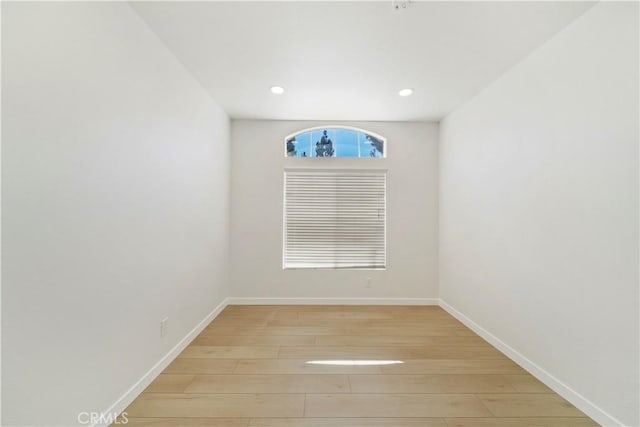 spare room with light hardwood / wood-style flooring