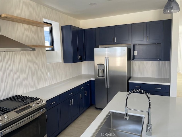 8019 Alder Ave, Fontana, CA 92336 - kitchen with stainless steel appliances, blue cabinetry, open shelves, and light countertops