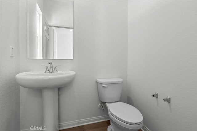 bathroom featuring sink and toilet