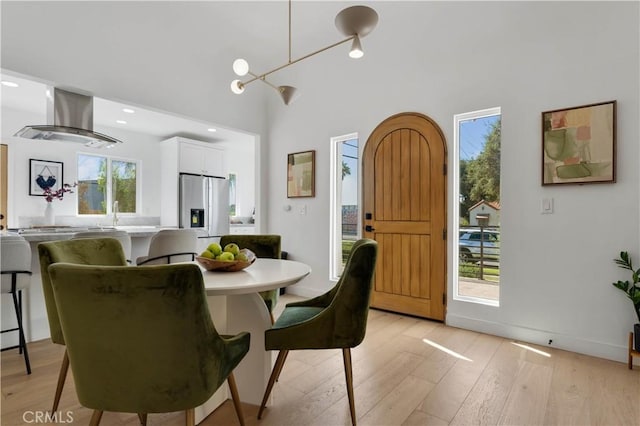 dining space with light hardwood / wood-style flooring