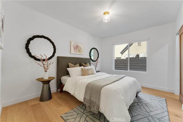 bedroom with light hardwood / wood-style floors