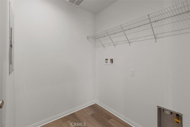 laundry area featuring hardwood / wood-style floors and hookup for a washing machine