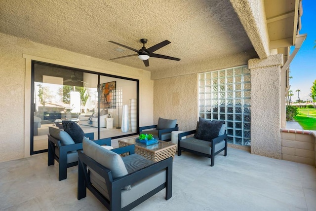 view of patio featuring an outdoor hangout area and ceiling fan