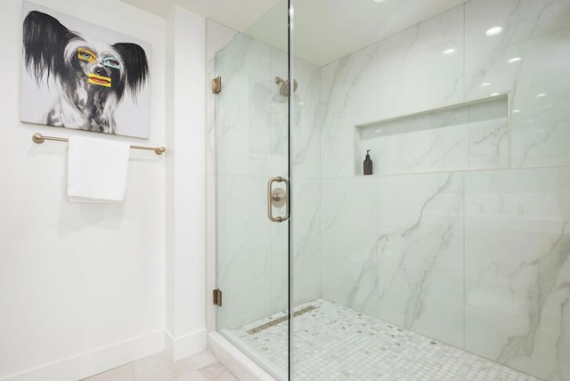 bathroom featuring an enclosed shower and tile patterned flooring