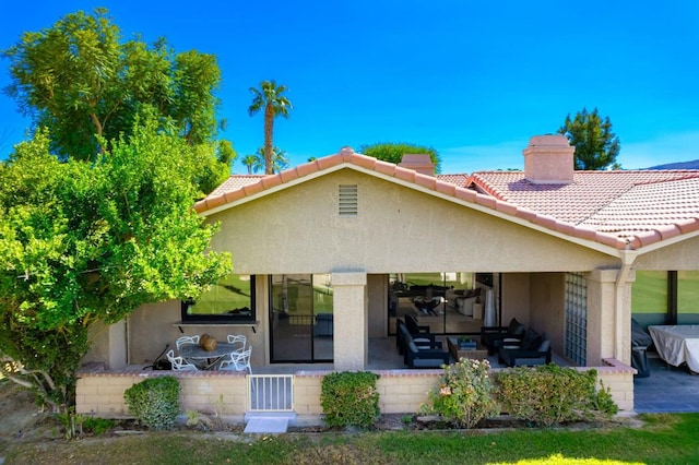 back of house featuring a patio