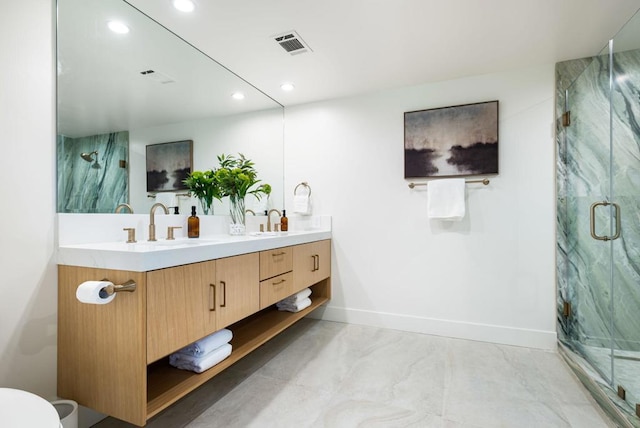 bathroom featuring vanity and an enclosed shower