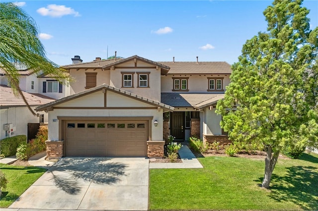 view of front of property featuring a front lawn and a garage