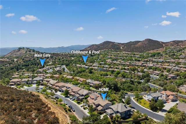 birds eye view of property with a mountain view