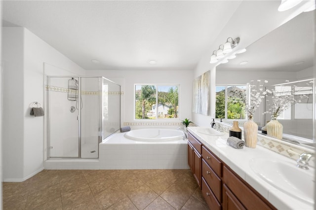 bathroom featuring vanity, lofted ceiling, tile patterned floors, and independent shower and bath