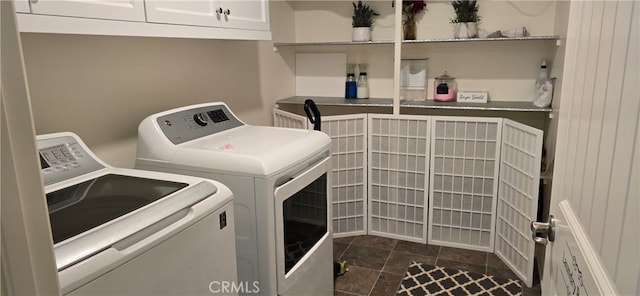 laundry room with cabinets and washing machine and dryer