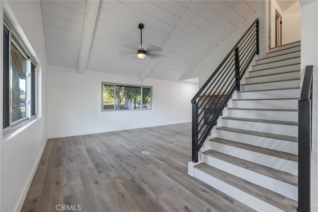 interior space featuring vaulted ceiling with beams, wood ceiling, and hardwood / wood-style floors