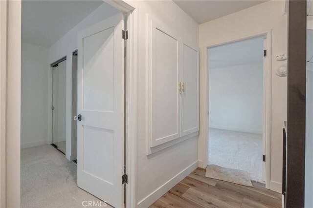 hall featuring light wood-type flooring