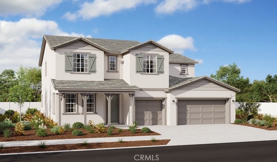 traditional-style home with driveway, fence, and stucco siding