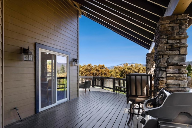 deck with a mountain view and a grill