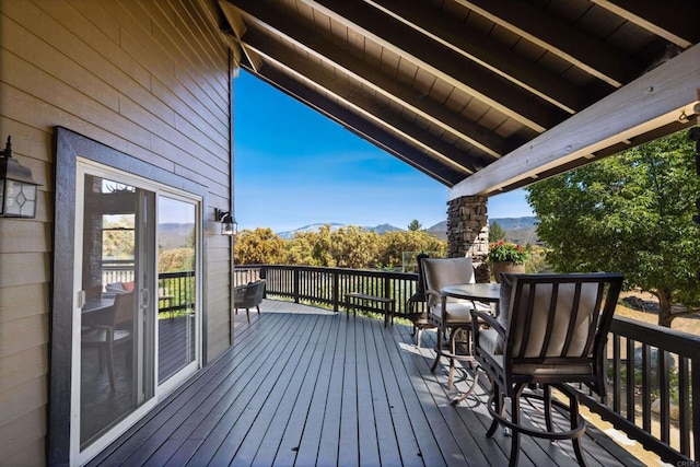 wooden terrace featuring a mountain view