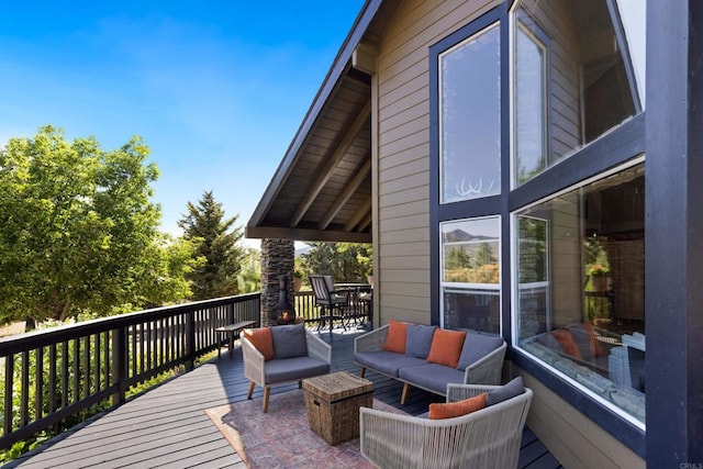 wooden deck with outdoor lounge area